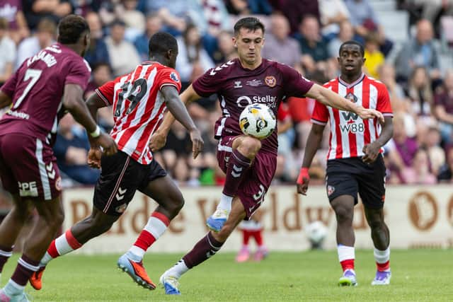 Hearts' Oisin McEntee (R) may have played his way into Derek McInnes’ starting XI.