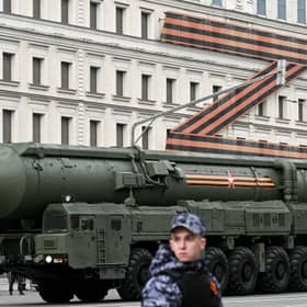 A Russian missile launcher drives past a massive 'Z-swastika' in St George's colours, used by Vladimir Putin as a symbol of his invasion of Ukraine, during a Victory Day parade rehearsal in Moscow (Picture: Kirill Kudryavtzev)