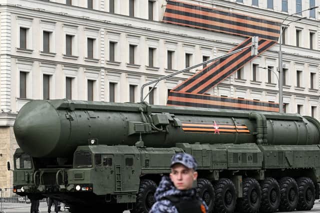 A Russian missile launcher drives past a massive 'Z-swastika' in St George's colours, used by Vladimir Putin as a symbol of his invasion of Ukraine, during a Victory Day parade rehearsal in Moscow (Picture: Kirill Kudryavtzev)