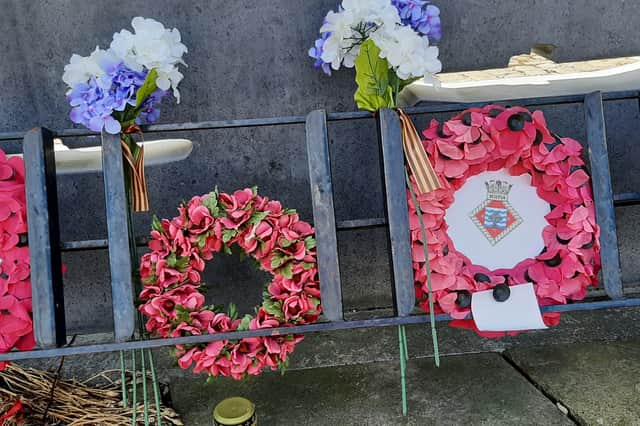 Black and orange ribbons of Saint George, seen on a war memorial in Dundee today, are a symbol of Russia's war on Ukraine