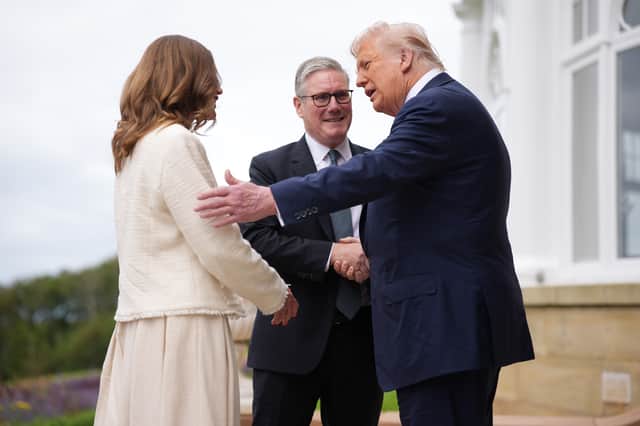 US President Donald Trump greets Prime Minister Keir Starmer and his wife Victoria at Trump Turnberry