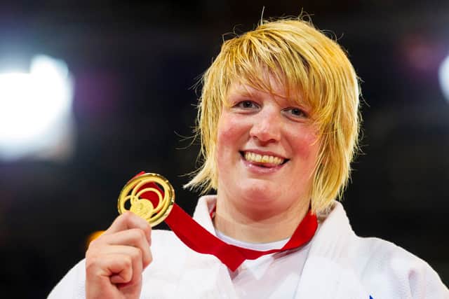 Scotland's Sarah Adlington with her gold medal after her win in the +78kg category at Glasgow 2014.