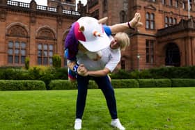 Sarah Adlington, the Commonwealth Games judo champion, practises her moves on official mascot Finnie the Unicorn during a Glasgow 2026 photocall at Kelvingrove Art Gallery and Museum.