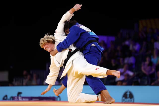 Sarah Adlington (in white) won gold again, beating Tulika Maan of India (in blue) in the judo +78kg final match at the Birmingham 2022 Commonwealth Games.