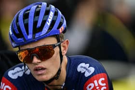 Team Picnic PostNL team's British rider Oscar Onley cycles to the finish line of the 19th stage of the 112th edition of the Tour de France.