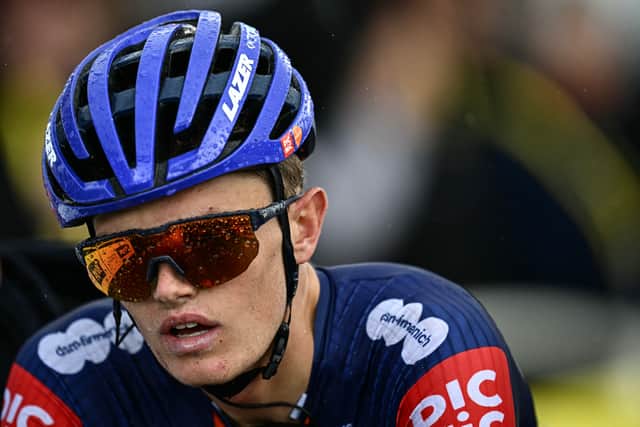 Team Picnic PostNL team's British rider Oscar Onley cycles to the finish line of the 19th stage of the 112th edition of the Tour de France.