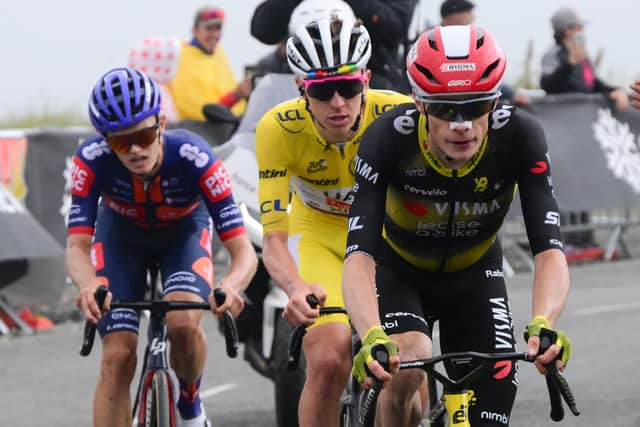 Team Picnic PostNL team's British rider Oscar Onley, left, UAE Team Emirates - XRG team's Slovenian rider Tadej Pogacar, wearing the leader's yellow jersey, and Team Visma - Lease a bike team's Danish rider Jonas Vingegaard on the ascent of Col de la Loze during the 18th stage of the Tour de France.