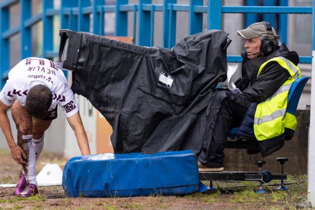 Hearts midfielder Cammy Devlin collides with a broadcast camera during a Premier Sports Cup group stage match against Stirling Albion at Forthbank Stadium. (Photo by Ross MacDonald / SNS Group)