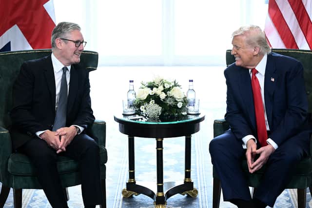 Prime Minister Sir Keir Starmer talks with US President Donald Trump at the Trump Turnberry golf resort in Turnberry