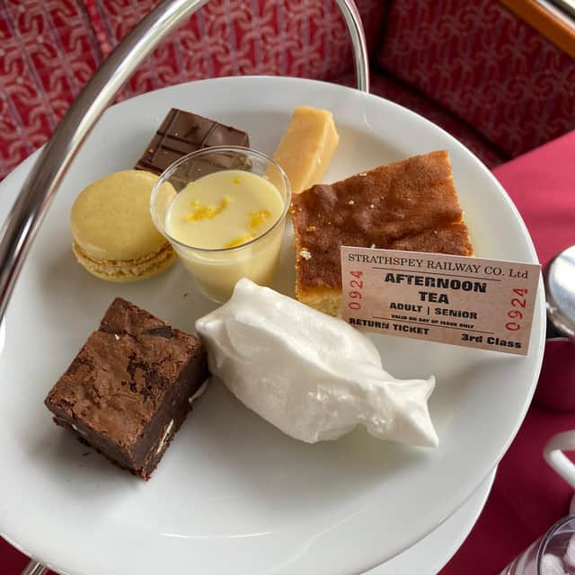 Sweet treats as well as sandwiches and scones are served in the Afternoon Tea on the Aviemore to Broomhill trip on Strathspey Railway.