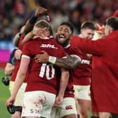 Bundee Aki and Finn Russell celebrate the British & Irish Lions' win over Australia in the second Test which clinched the series.