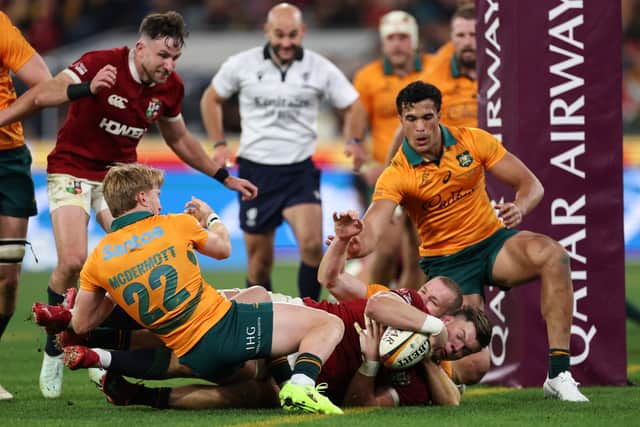 Huw Jones scores for the British & Irish Lions during the second Test against Australia  at the Melbourne Cricket Ground.