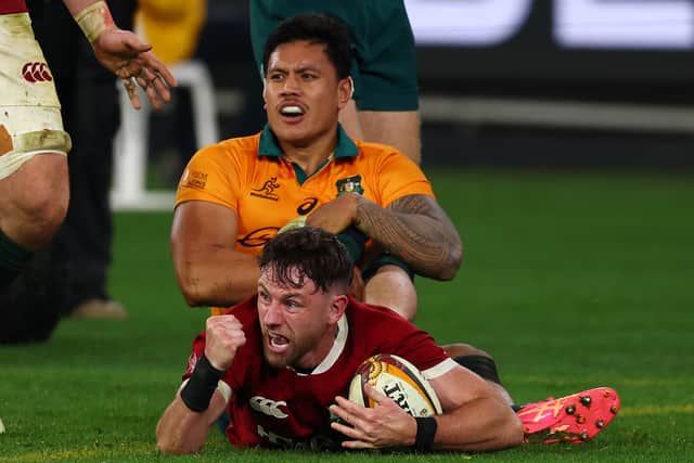 Hugo Keenan celebrates scoring the winning try for the Lions against the Wallabies in Melbourne.