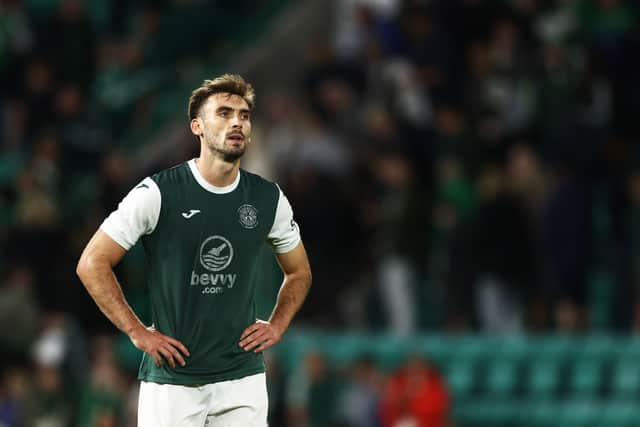 Hibs' Warren O'Hora looks on after the defeat by Midtjylland.