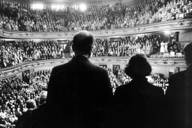 The audience stands for the national anthem in the Usher Hall as the first Edinburgh International Festival gets underway
