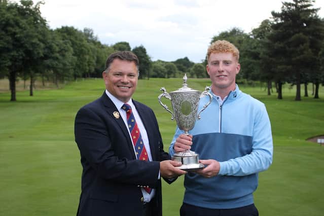 Royal Troon’s Harvey Broadfoot is presented with the Cameron Corbett Vase by Haggs Castle captain Craig Morrison