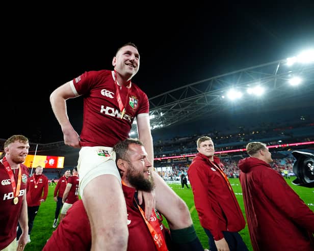 British and Irish Lions' Finn Russell celebrates on the shoulders of Pierre Schoeman after winning the series against Australia.