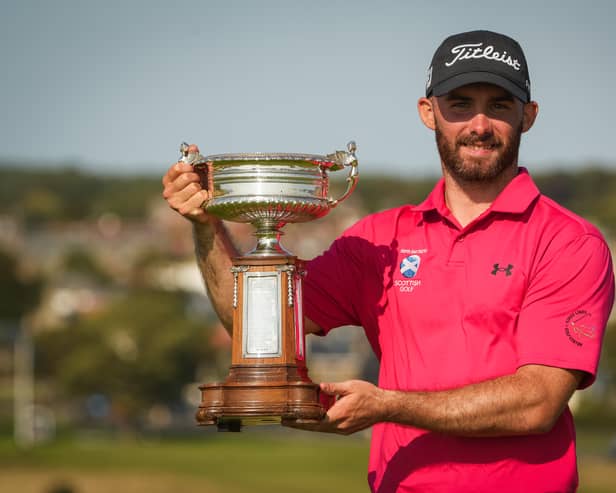 Murcar Links member Chris Somers shows off the trophy after winning the Scottish Amateur Championship at Gullane 
