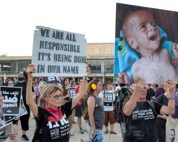 Israeli activists protest in Tel Aviv about the ongoing food shortages in the Gaza Strip (Picture: Jack Guez)