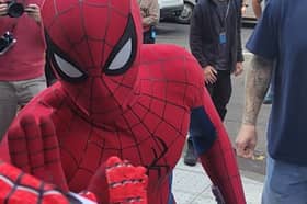 Tom Holland high-fives boy while filming Spider-Man in Glasgow.
