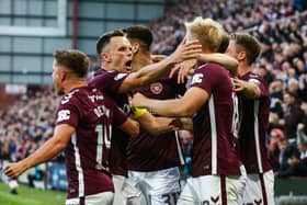 Hearts' Harry Milne (R) and Lawrence Shankland (L) celebrate after Aberdeen's Graeme Shinnie scores an own goal. (Photo by Ewan Bootman / SNS Group)