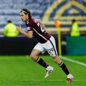 Tomas Bent Magnusson comes on for his Hearts debut against Aberdeen.
