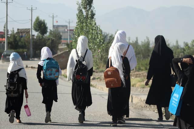 Girls walk to school in Gardez, Paktia province, Afghanistan, in 2022 before they were banned from receiving an education by the Taliban. Some classes continue in secret