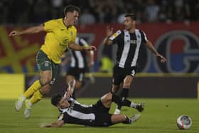 Hibs' Josh Mulligan, left, duels for the ball with Partizan's Milan Vukotic.