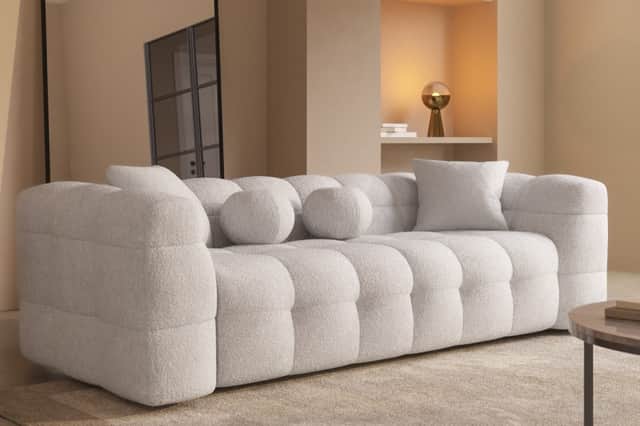 Furniture123’s Alessia bouclé sofa makes a statement with its cloud-like curves and plush texture, bringing instant luxury to any living space.