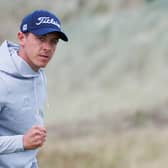 Grant Forrest celebrates after holing a putt for birdie at the 17th hole on day three of the Nexo Championship at Trump International Golf Links 