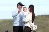 Grant Forrest celebrates with his wife Christy and son Spencer  on the 18th green, after winning the Nexo Championship at Trump International Golf Links