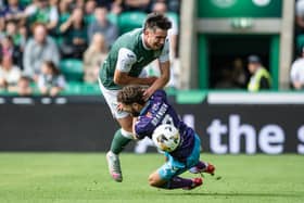 Jamie Brandon and Kieron Bowie collide during Hibs' 2-2 draw with Kilmarnock.