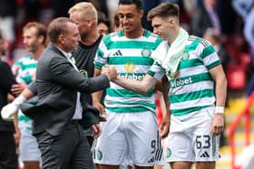 Brendan Rodgers congratulates Adam Idah and Kieran Tierney after Celtic's win over Aberdeen.