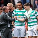 Brendan Rodgers congratulates Adam Idah and Kieran Tierney after Celtic's win over Aberdeen.