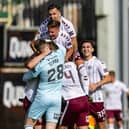 The Hearts players celebrate their win over Dundee United at Tannadice.