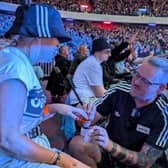 Dwayne Yuill proposing to his partner of six years, Shell Hodge at the first of Oasis's three nights in Edinburgh on August 8.