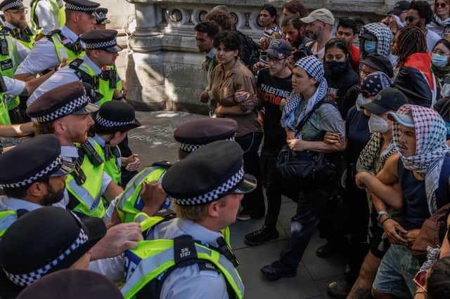 Police and protesters confront each other during a demonstration in support of Palestine Action outside the High Court in London (Picture: Dan Kitwood)