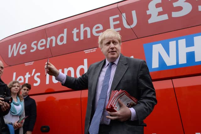 Boris Johnson campaigns for Brexit ahead of the 2016 referendum with a bus featuring a debunked claim about NHS funding (Picture: Stefan Rousseau)