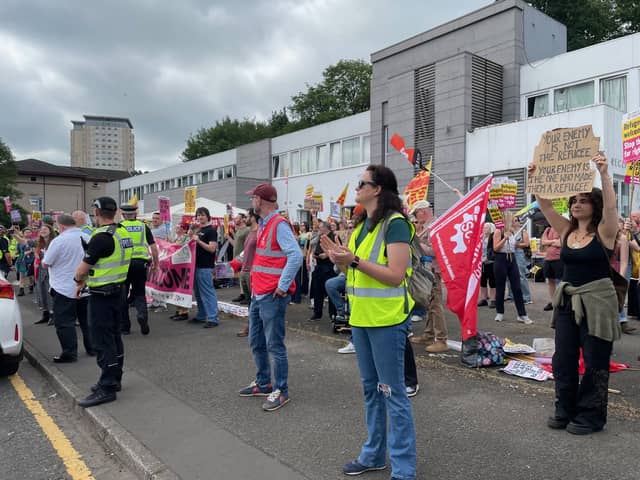 Anti-racism counter-protesters across from the demonstrators protesting against "uncontrolled illegal immigration" outside the Cladhan Hotel in Falkirk.