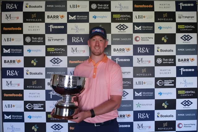 Greg Dalziel shows off the trophy after winning the Leven Links Classic presented by The MacKay Clinic