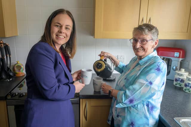 Muriel Allison with Kate Forbes as she becomes the first resident in the world to install the Kight PowerHub battery storage energy system