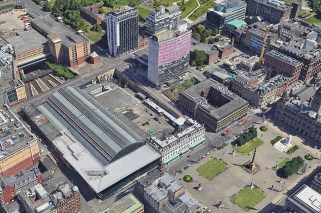 The gap site is to the right of the station's arched roof, behind the Millennium Hotel that fronts George Square, with North Hanover Street to the right of the hotel