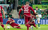Josh Mulligan scores for Hibs to ensure Legia Warsaw will only take a one-goal lead back to Poland in the Conference League play-off tie. (Photo by Ross Parker / SNS Group)