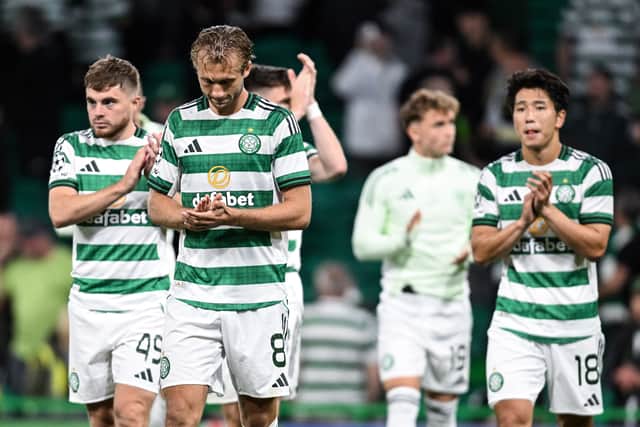 Celtic players applaud the fans following their disappointing 0-0 draw with Kairat Almaty in the Champions League playoff first leg tie at Celtic Park.