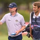 Cameron Adam gives a thumbs up to the crowd as he walks off the 18th green with caddie Gregor Tait aetfred British Masters hostt the end of day three of the Bed by Sir Nick Faldo at The Belfry in Sutton Coldfield