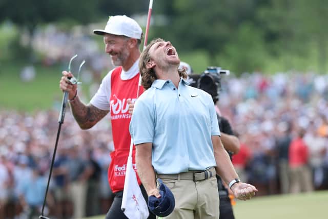 Tommy Fleetwood of England celebrates on the 18th green after winning the final round of the TOUR Championship 2025 at East Lake Golf Club.