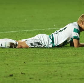 Celtic's Daizen Maeda lies on the grass after failing to score during the Champions League play-off second leg defeat to Kairat Almaty. (AP Photo/Alikhan Sariyev)