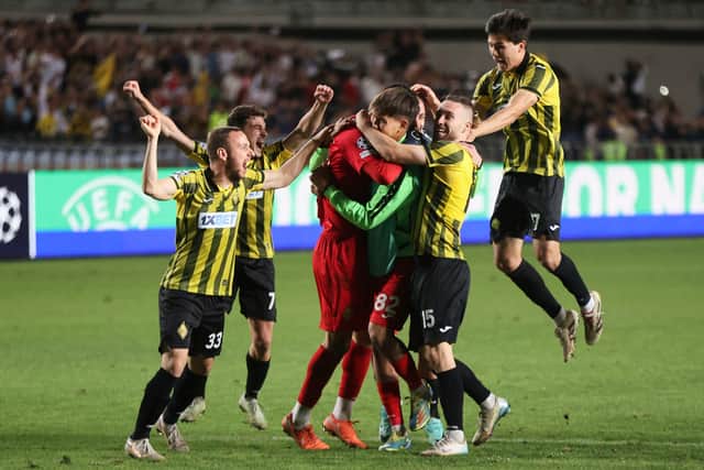 Kairat players celebrate after winning the Champions League playoff second leg against Celtic on penalties. (AP Photo/Alikhan Sariyev)