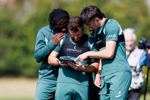 Rocky Bushiri, Nicky Cadden and Kieron Bowie at a Hibs training session ahead of the trip to Legia Warsaw in the Conference League play-off second leg.  (Photo by Mark Scates / SNS Group)