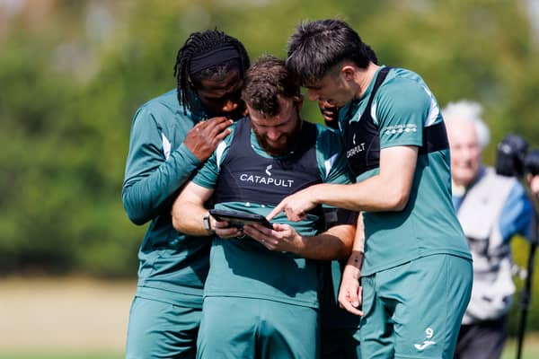 Rocky Bushiri, Nicky Cadden and Kieron Bowie at a Hibs training session ahead of the trip to Legia Warsaw in the Conference League play-off second leg. (Photo by Mark Scates / SNS Group)